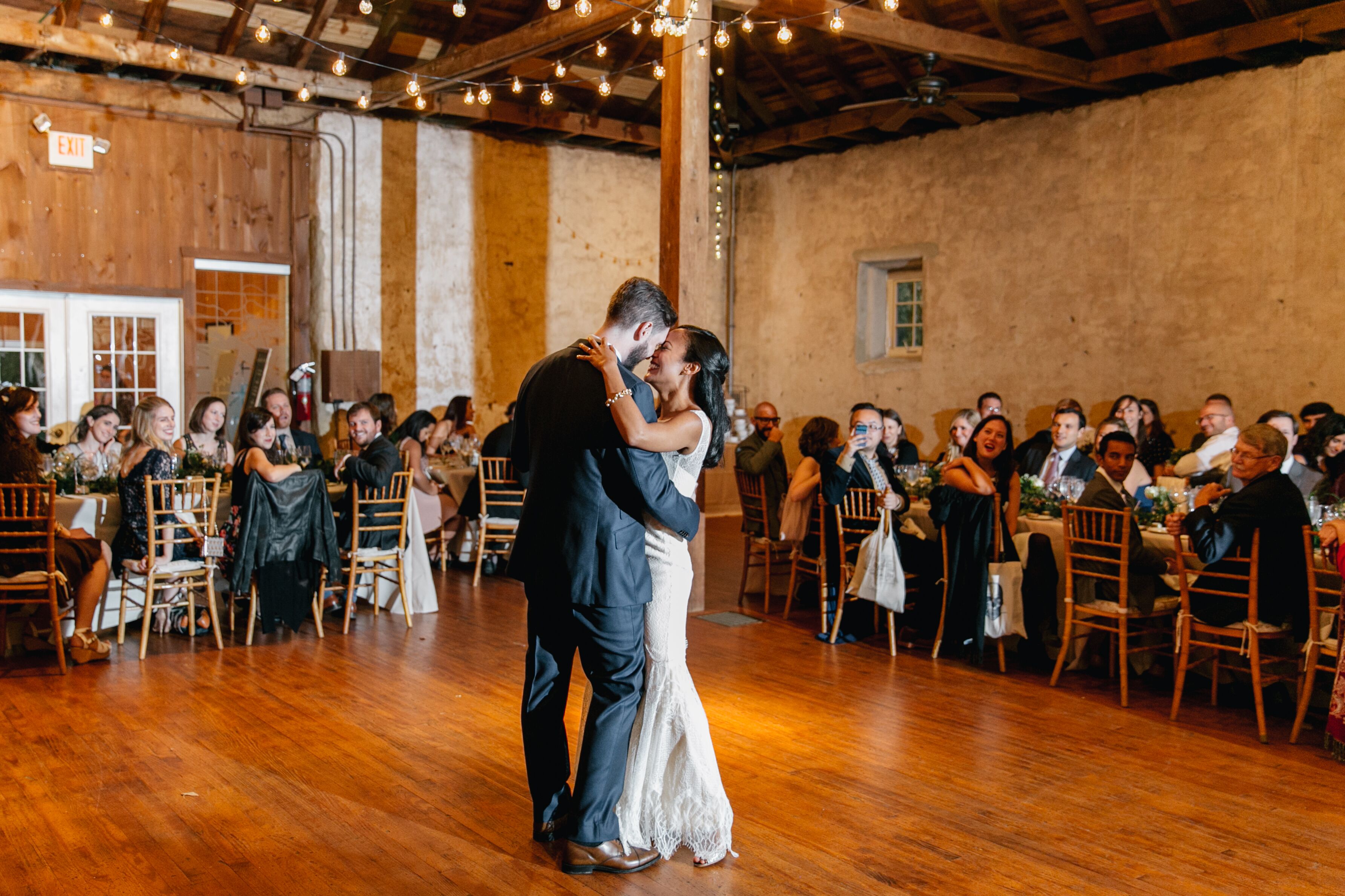 First Dance Under Barn's String Lights