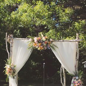 Bright Floral Aisle Markers in Moss Vases