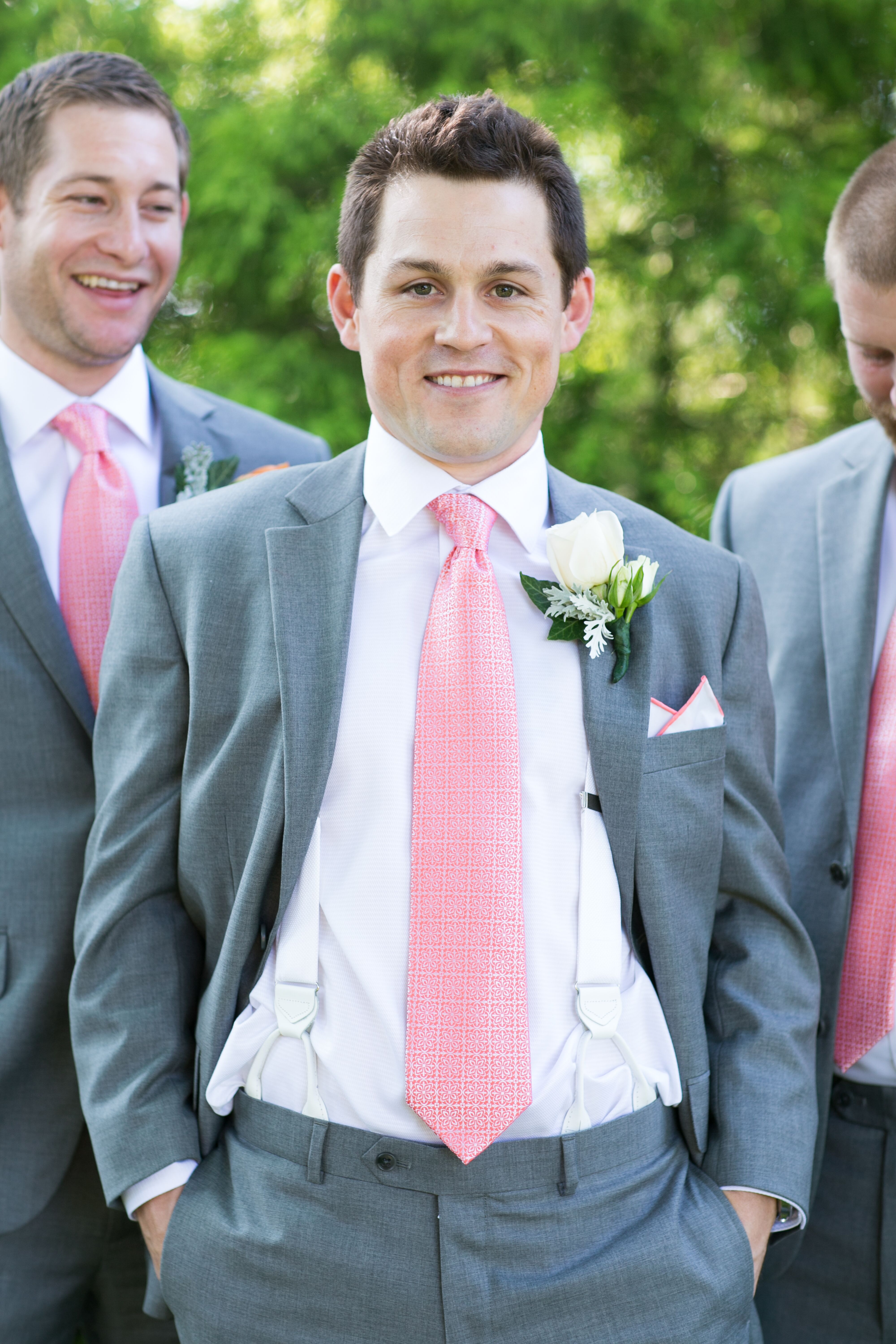 Groom in a Gray Suit and a Pink Tie with Groomsmen