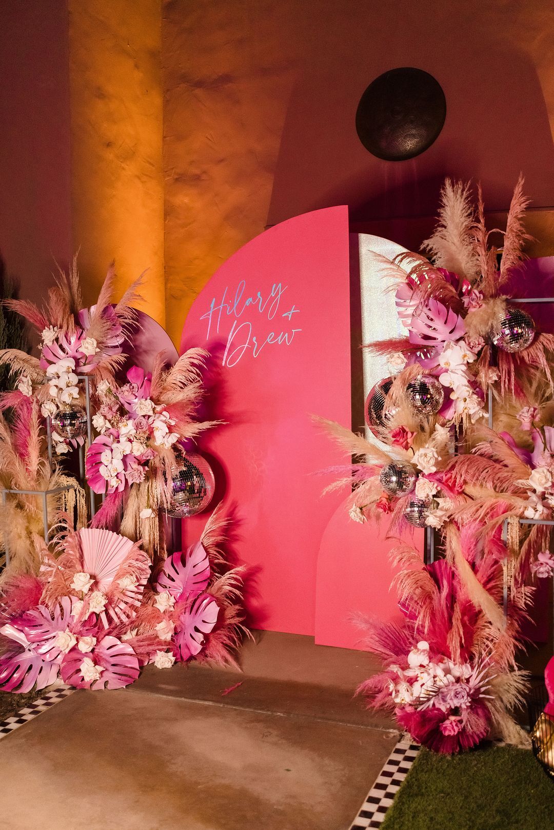 Ceremony Arrangement Converted to Pink Photo Backdrop With Disco Balls