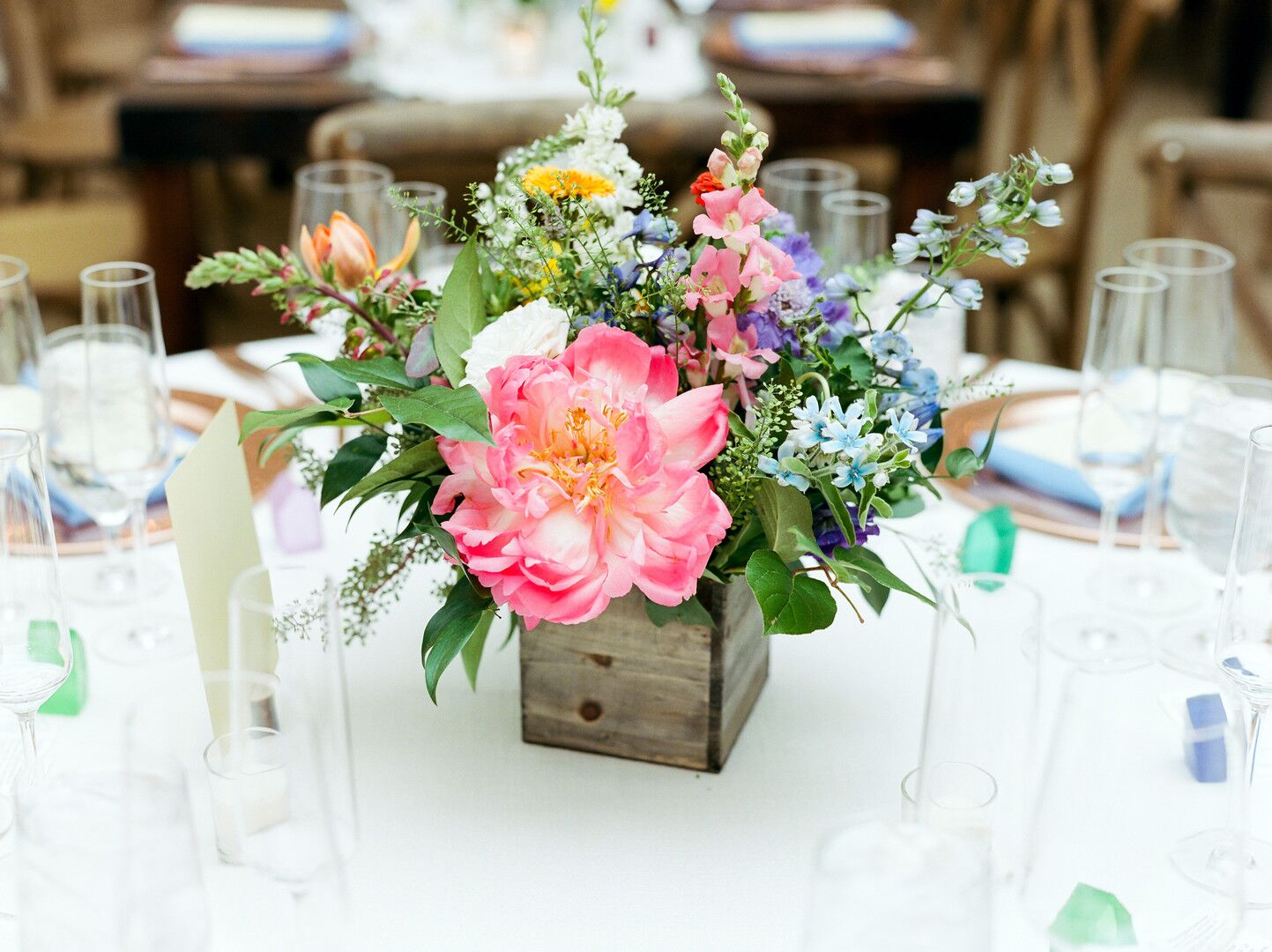 Colorful Centerpieces in Rustic Woodedn Vases
