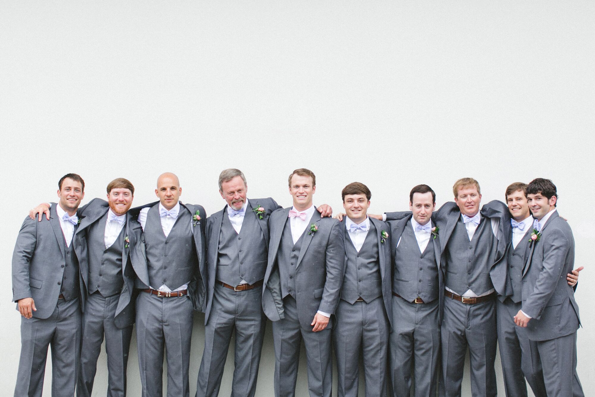 Groomsmen in Gray Three-Piece Suits from Men's Warehouse