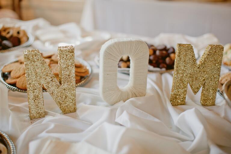 Gold glitter and yarn wrapped cardboard initials