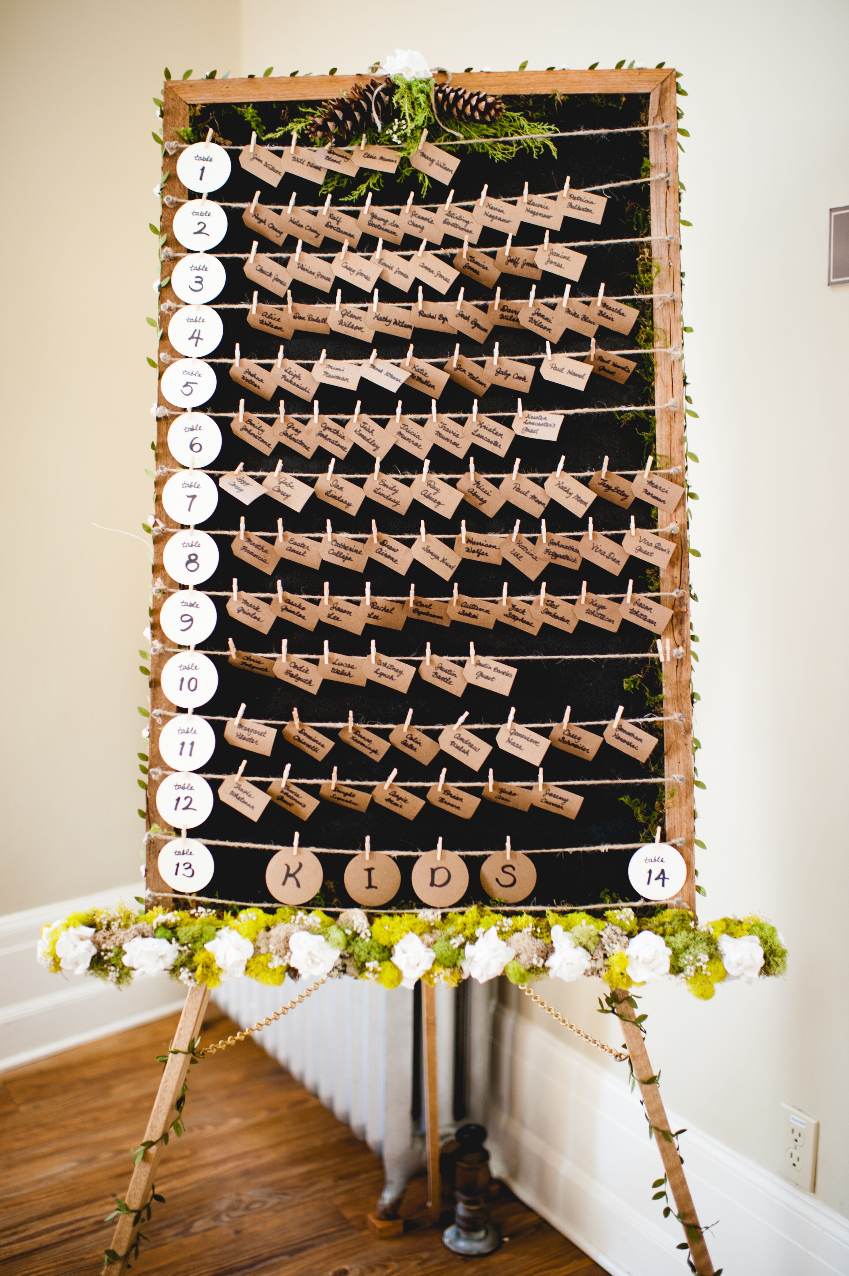 diy escort card display on blackboard