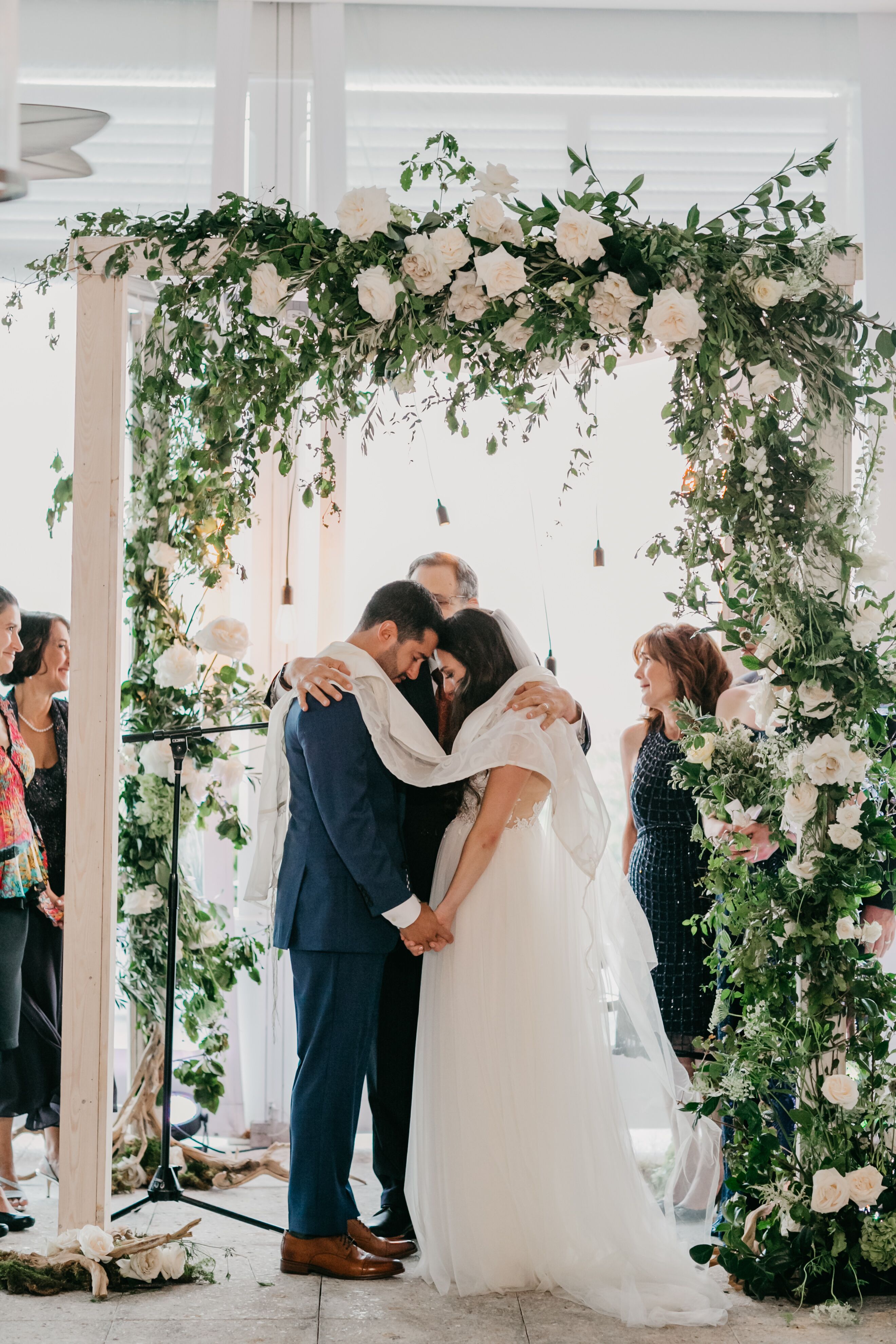 Couple Under Greenery Chuppah