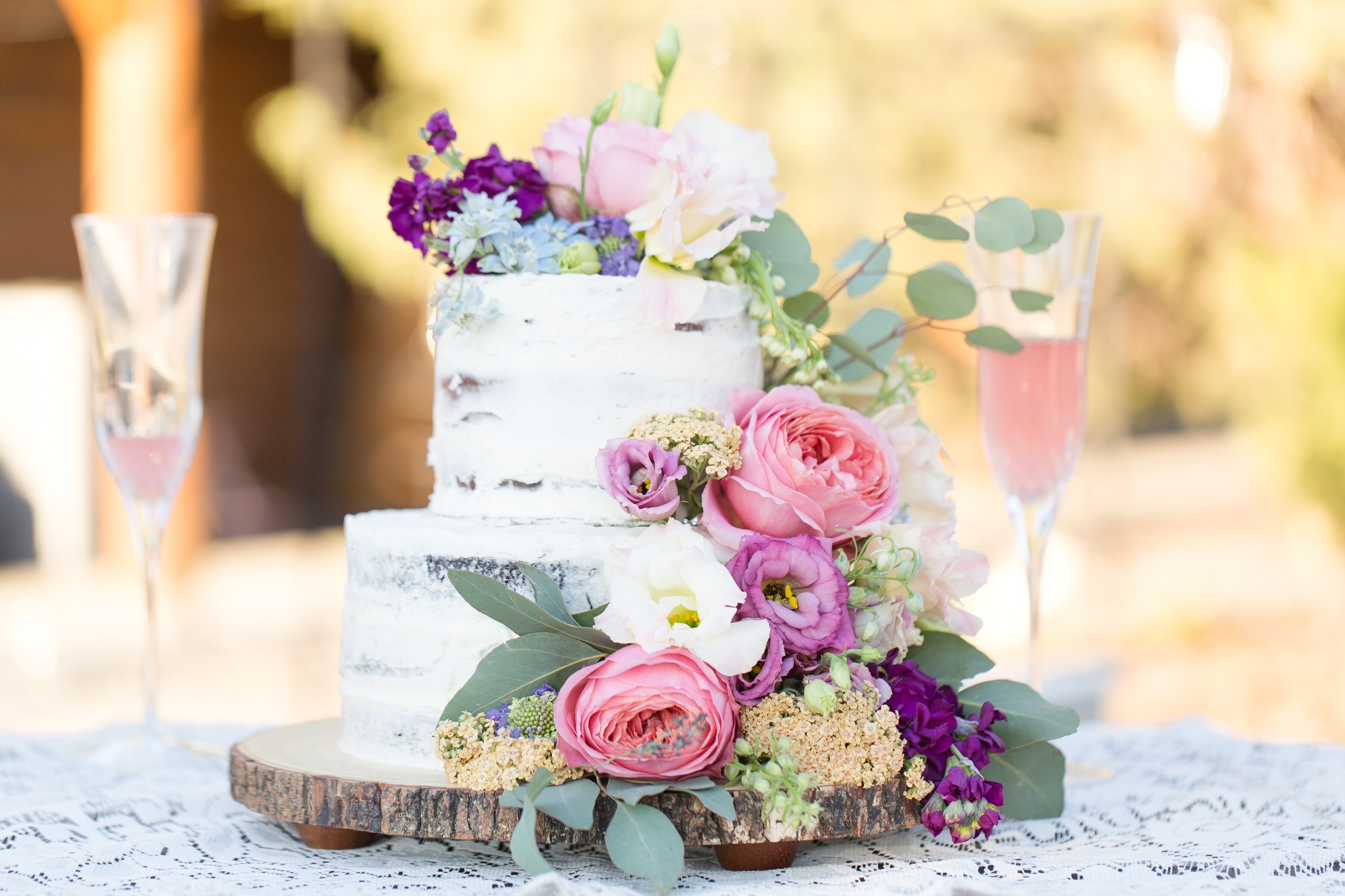 Naked Wedding Cake With Ranunculus Eucalyptus