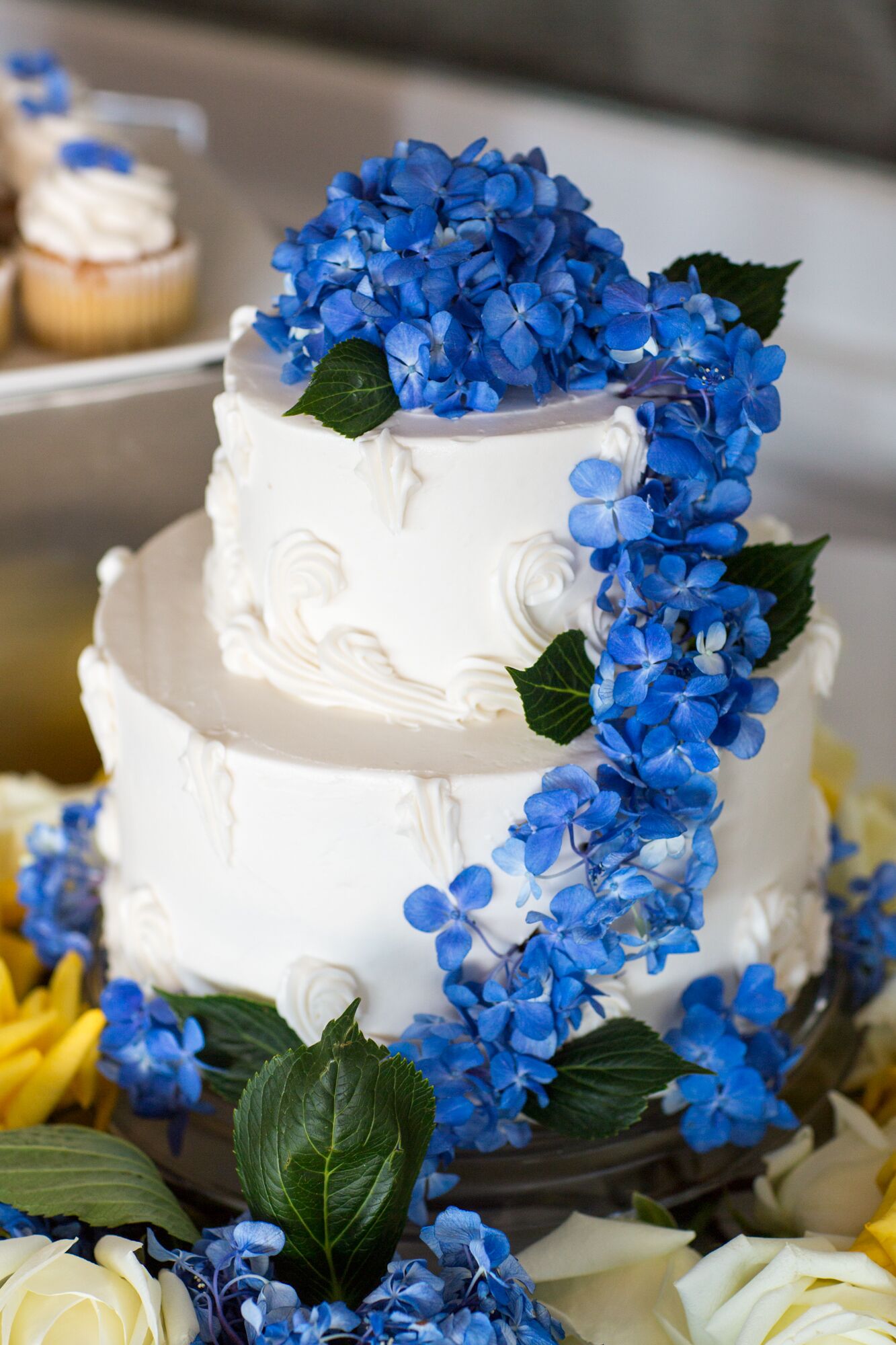 Two-Tier Wedding Cake with Cascading Blue Flowers