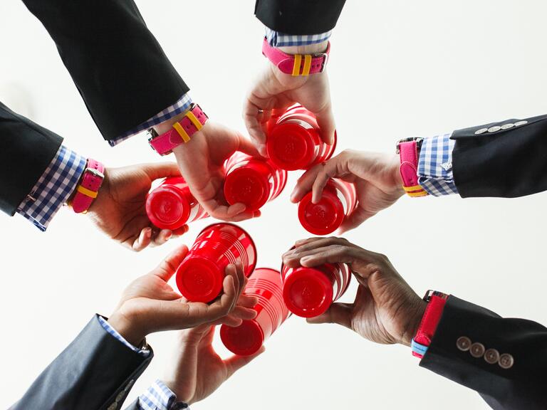 Groomsmen toast with red Solo cups