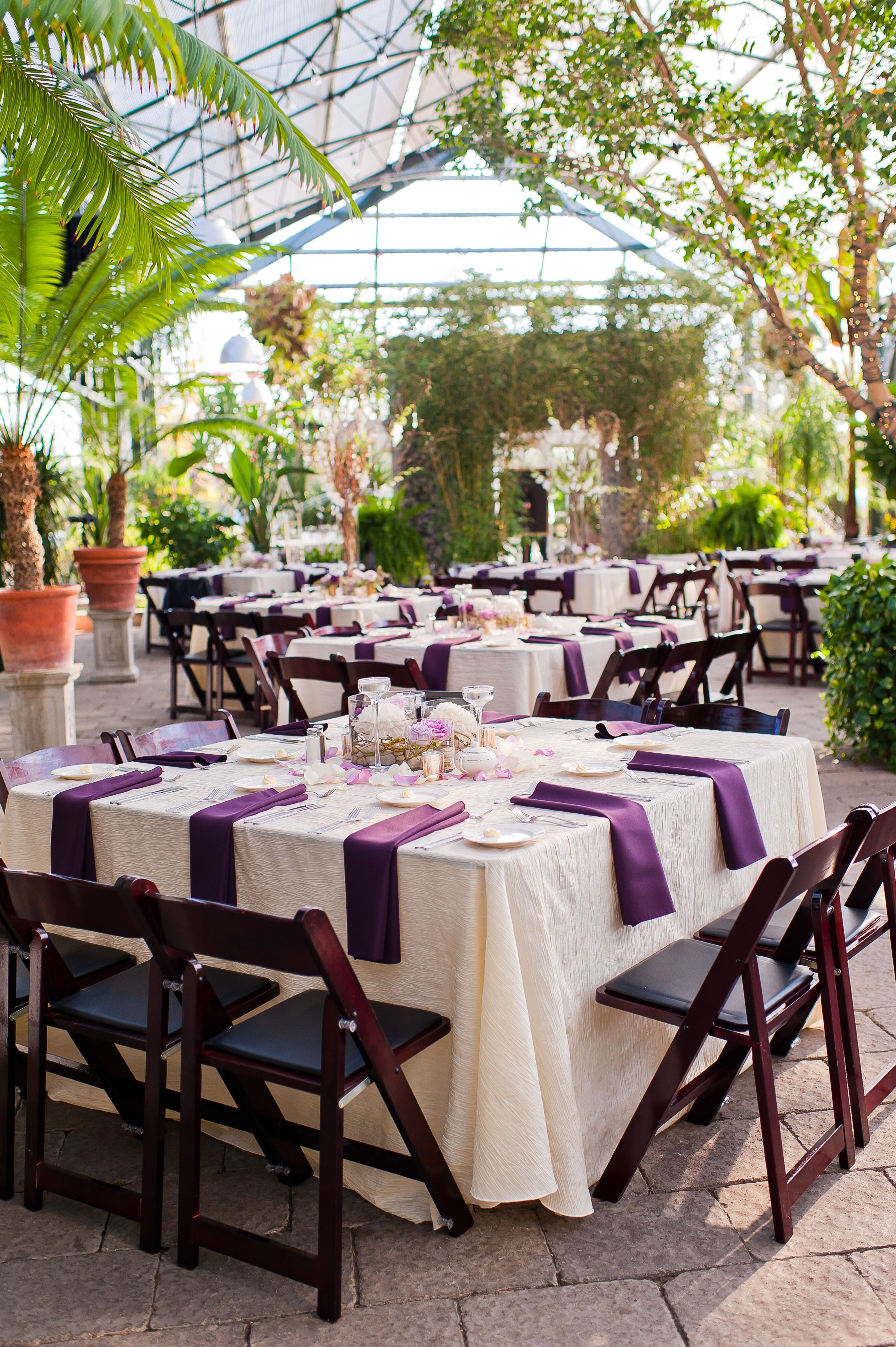 Purple and White Linens with Brown Folding Chairs