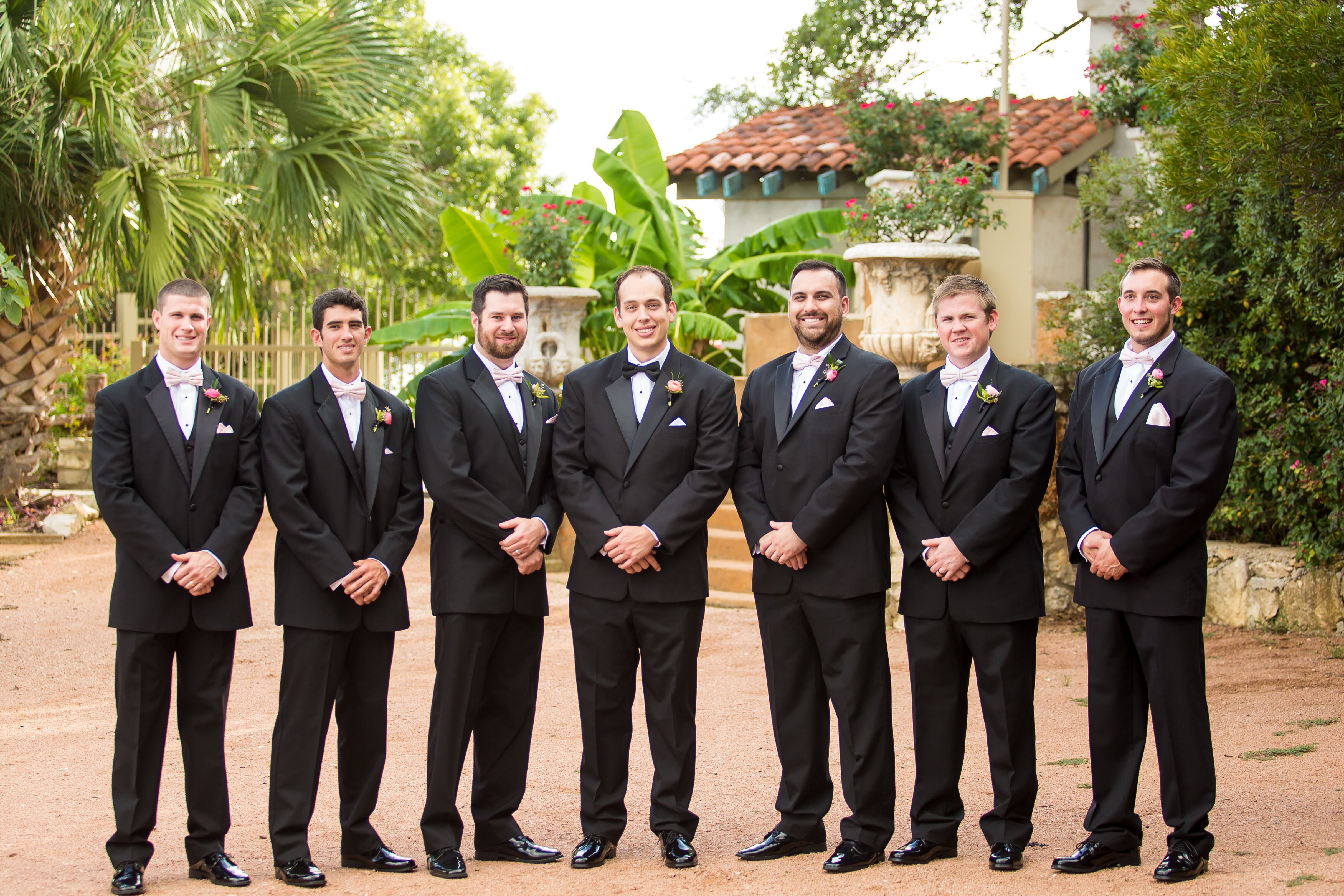 Black Gucci Groomsmen Suits with Bow Ties and Blush Boutonnieres