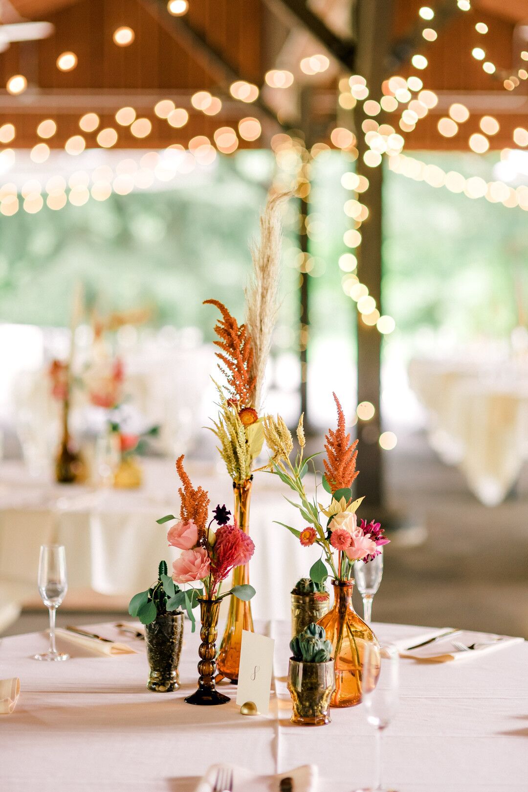 Small Eclectic Centerpieces with Mismatched Vases