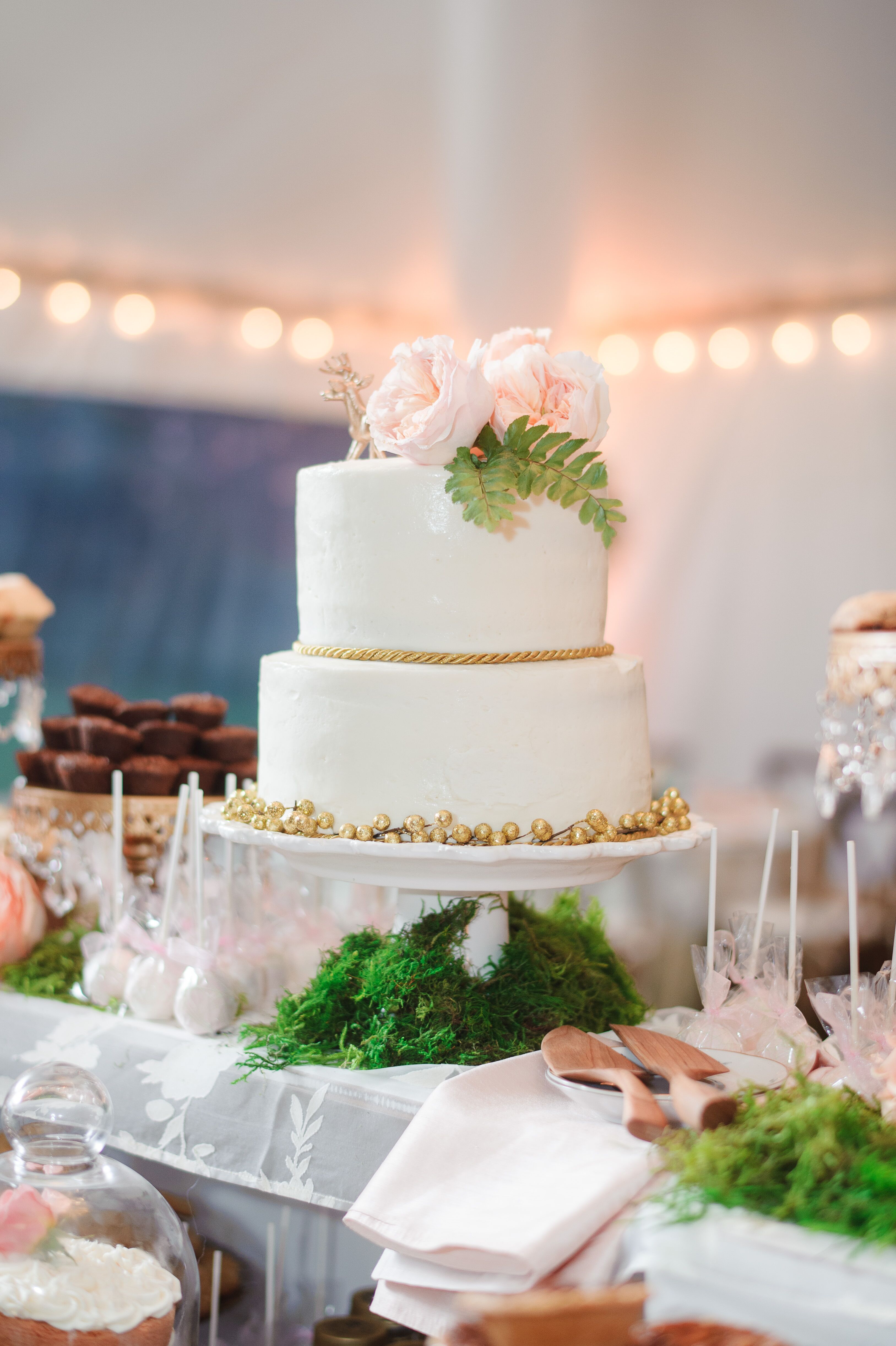 Tiered White Wedding Cake with Gold Accents