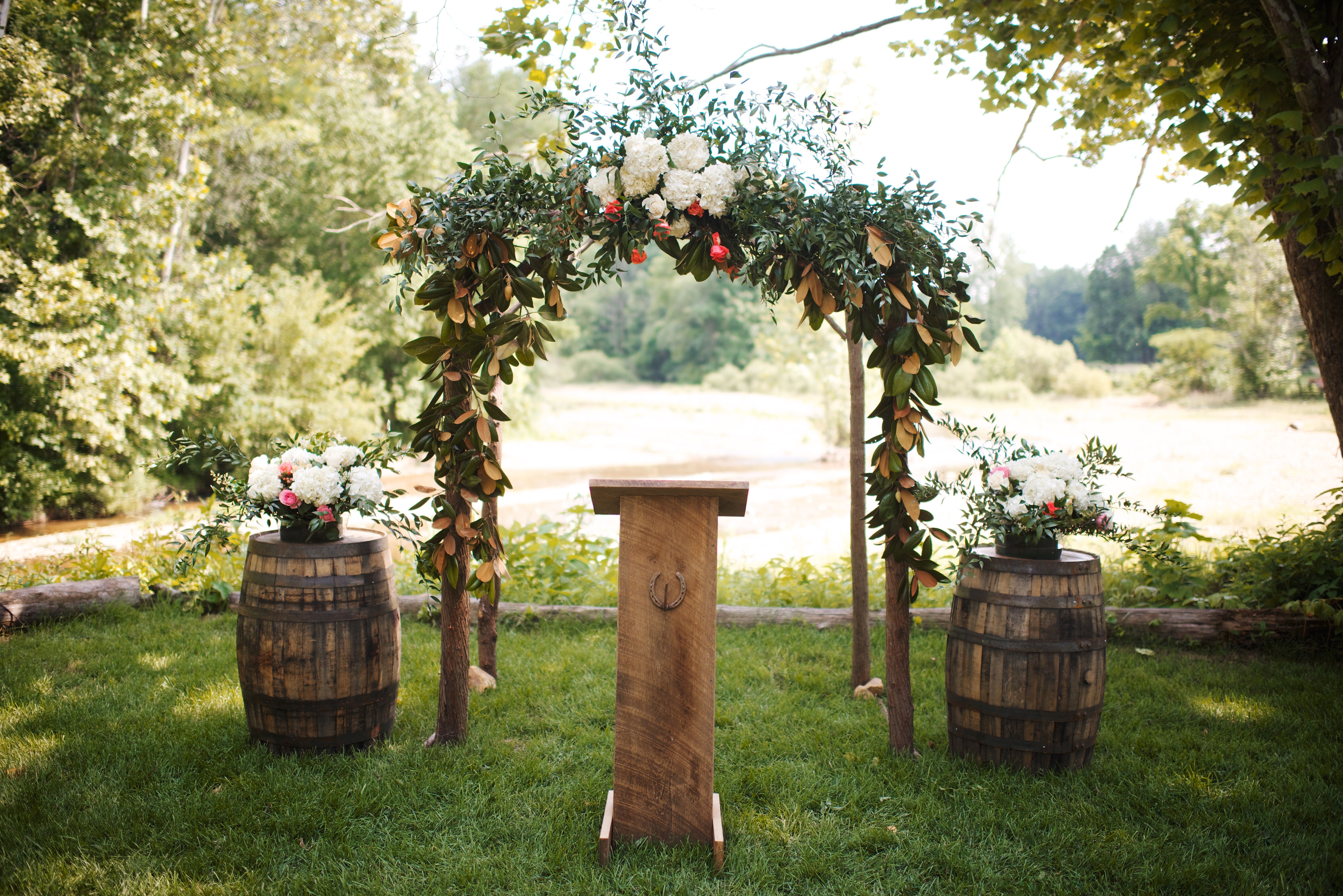 Natural Wooden Wedding Arch With Greenery