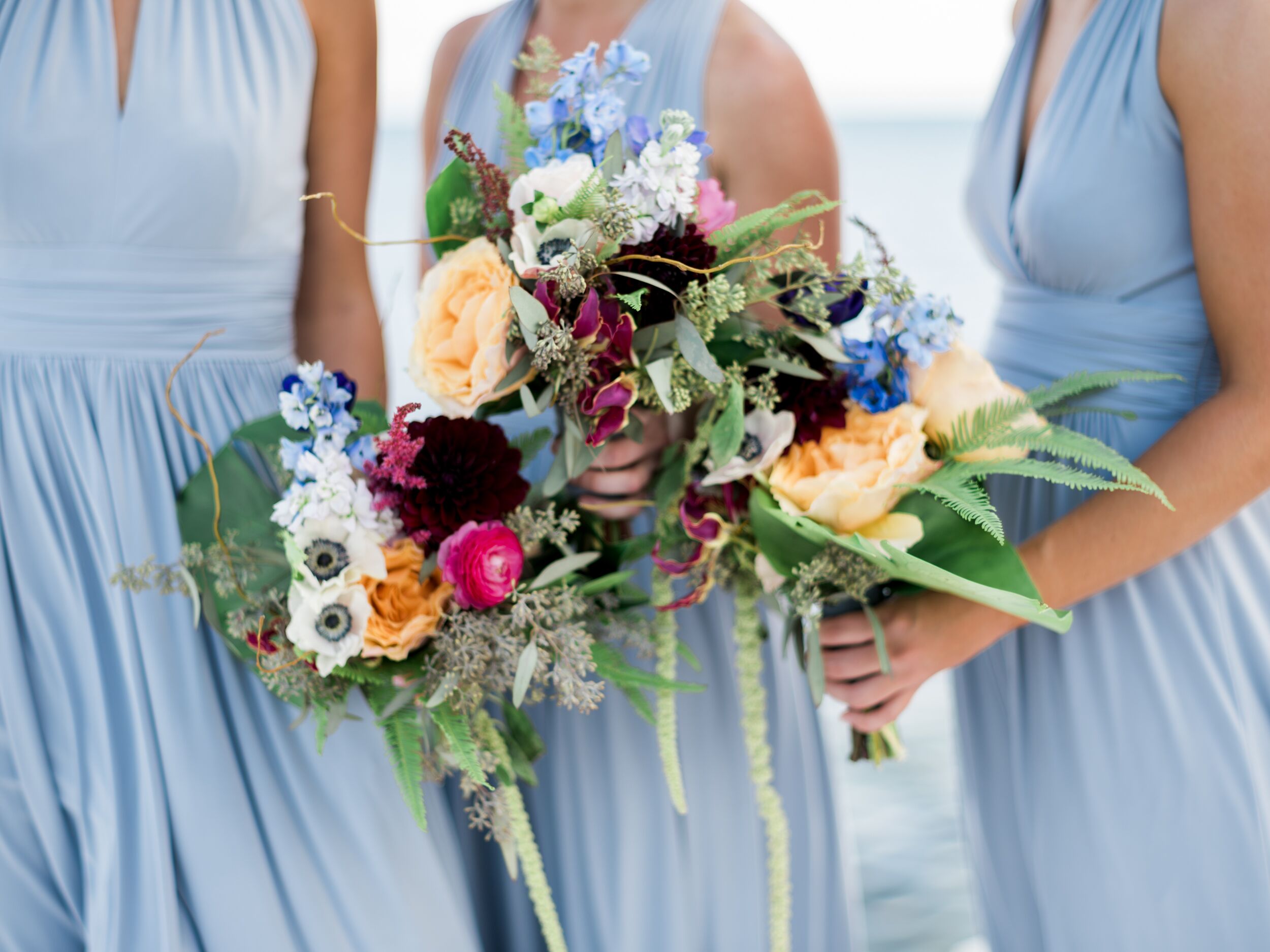 Pale Blue Bridesmaid Dresses and Tropical Bouquets