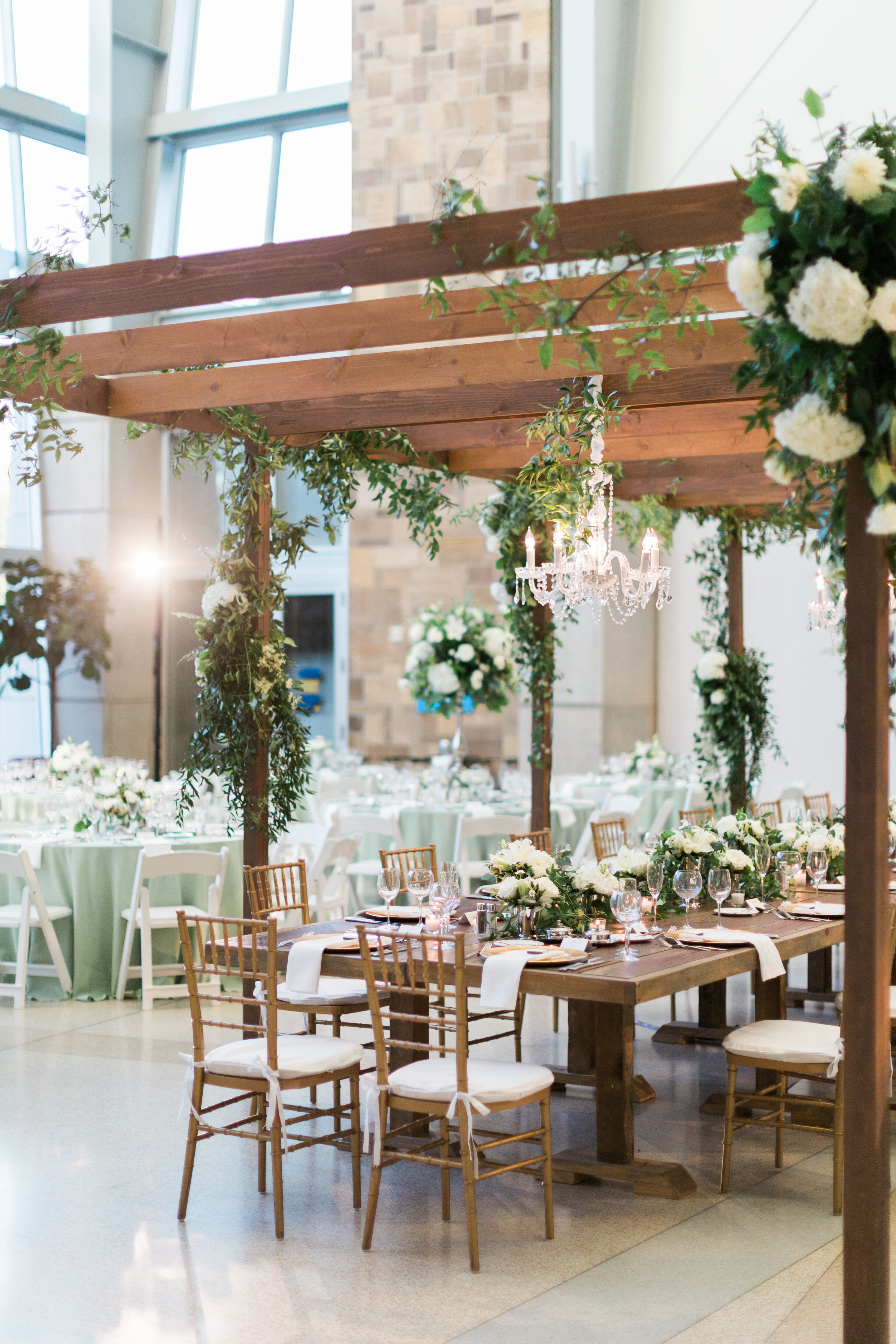 GreeneryDraped Pergola Reception Decor