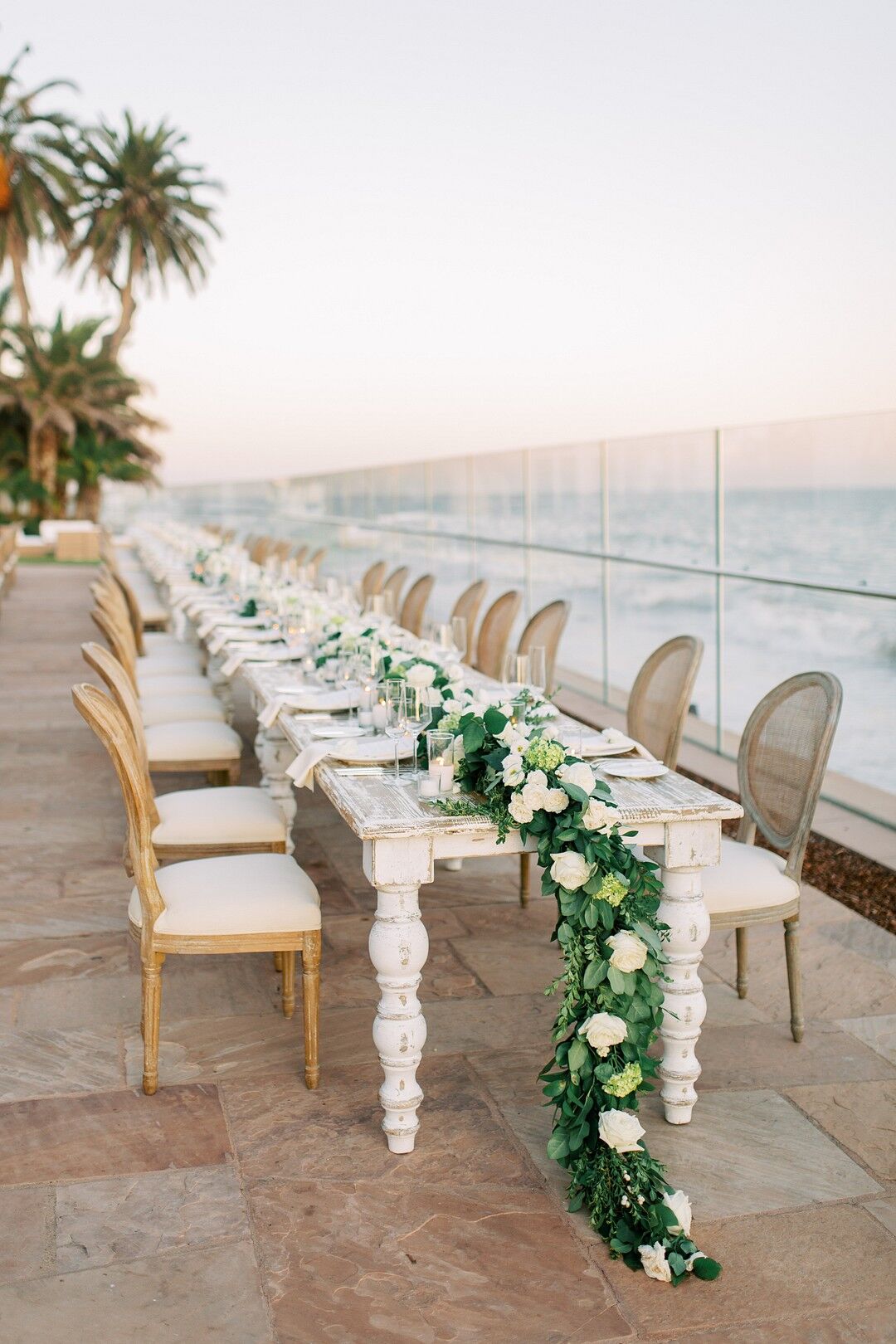 Intimate Waterfront Dining Table with Greenery Garland Centerpiece