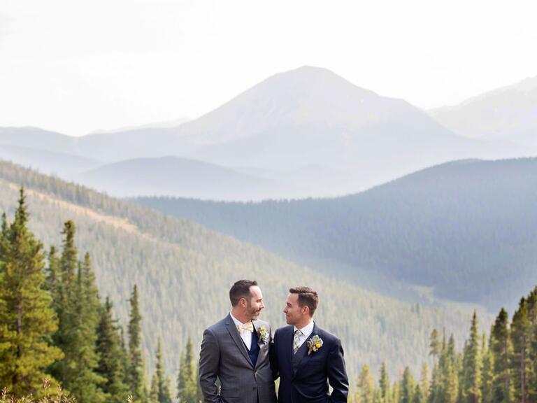 Same sex newlyweds standing in the mountains in Colorado